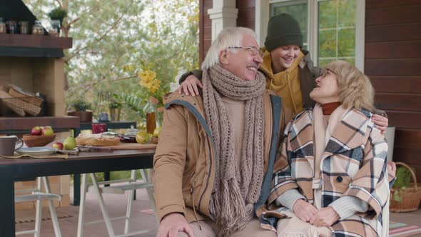 Happy Senior Couple and Their Grandson