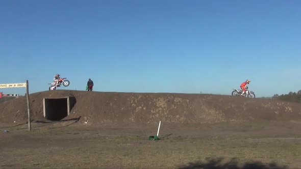 Men racing in a motocross motor sports race.