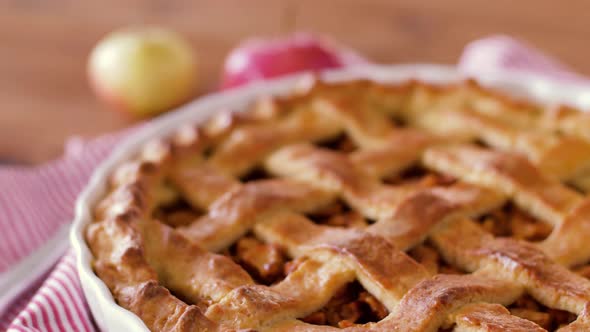 Close Up of Apple Pie and Knife on Wooden Table