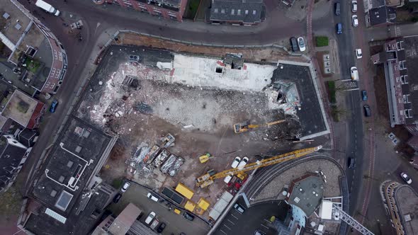 Demolition of a police station using building hydraulic shears, Aerial topdown