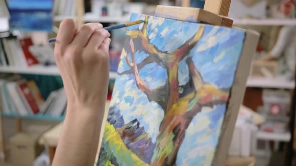 Artist Is Applying Finish Strokes on Landscape Pictures Closeup of Canvas