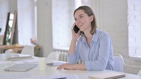 Happy Young Woman Talking on Smart Phone