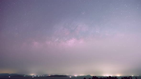 Time lapse Milky way galaxy stars Night to day Timelapse seen in Phuket Thailand. Beautiful Nature