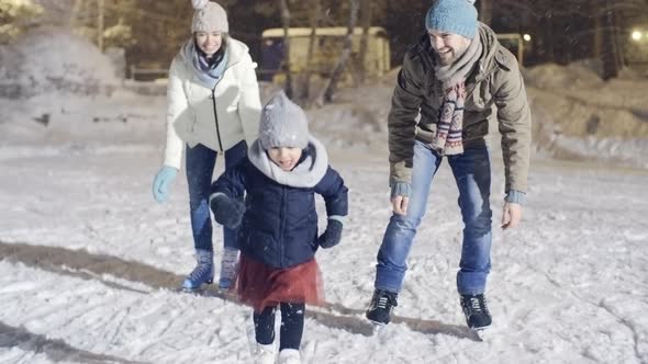 Funny Little Girl Falling while Ice Skating