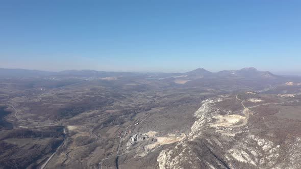 Mountain ranges of Deli Jovan Krsh and Stol near town of Bor 4K drone video