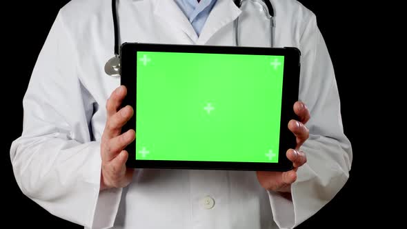 Cropped View of Doctor Holding Tablet with Green Screen