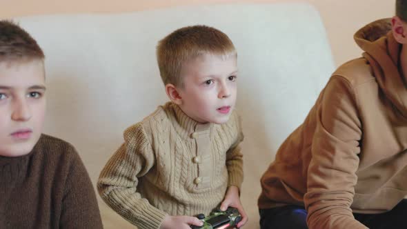 Children Play on the Console with Joysticks in Ruhs