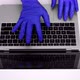 Using laptop computer with medical gloves - VideoHive Item for Sale