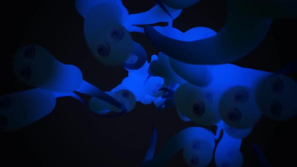 Close-up animation of a group of many blue, translucent worms or sperm cells.