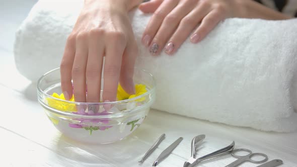 Manicured Hands Receiving Spa Treatment.