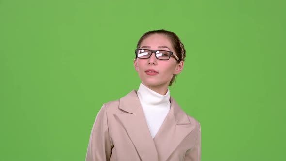 Elegant Woman Flirts and Builds Eyes To the Guys. Green Screen. Slow Motion