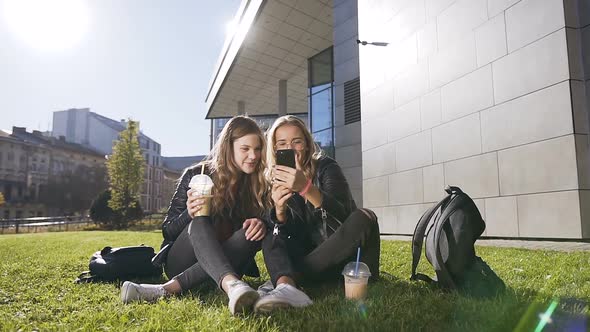 Attractive Teen Girlfriends with Smartphone Laughing