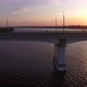 Aerial Shot of a Lofty Bridge at Golden Sunset From a Drone Moving Along in Summer - VideoHive Item for Sale