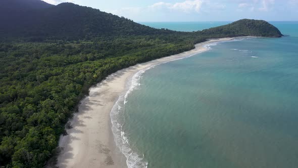 Cape Tribulation in Daintree Rainforest aerial of sunny beach and turquoise water, Queensland, Austr