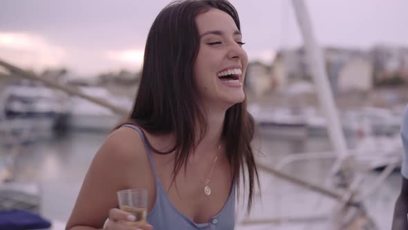 Beautiful Smile of a Young Woman Dancing at the Party in the Marina Near the Sea