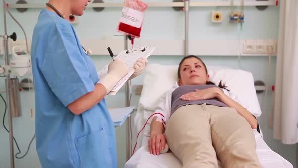 Nurse next to a patient while standing