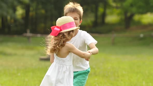 Children Swim in the Summer Park, They Are Happy and Cheerful. Slow Motion