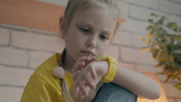 Little Girl Using Her Kids Smart Watch