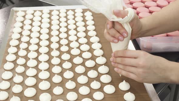 Shot of a Pastry Chef Preparing Meringues at the Kitchen