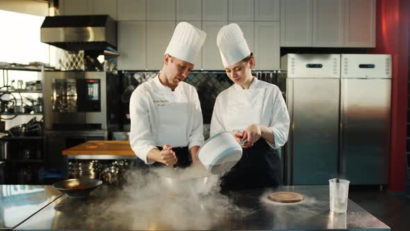 Professional kitchen: liquid nitrogen is added during the cooking of a molecular dish