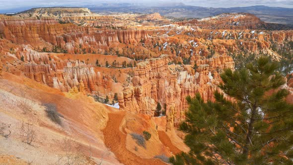 Steadicam Shot of Bryce Canyon National Park in Sunny Winter Day with Snow, Сamera Moves Out From