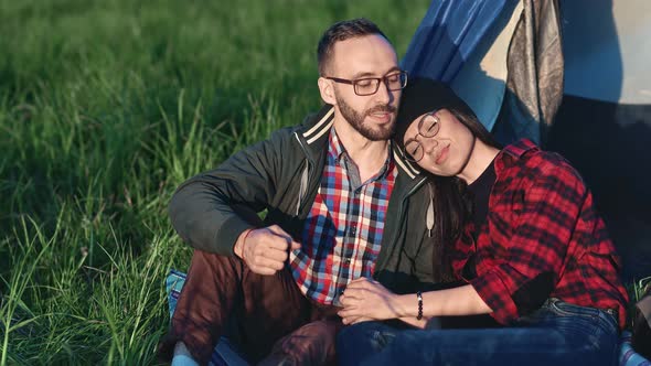Handsome Hipster Guy Speaking Smiling During Date with Happy Girl at Camping