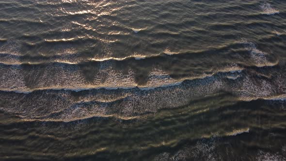 Top View of Texture Waves Sandy Beach