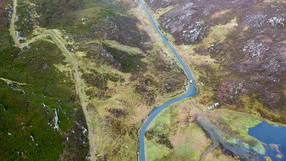 White Car Driving Through Gap Mamore Inishowen Peninsula County Donegal  Republic Ireland