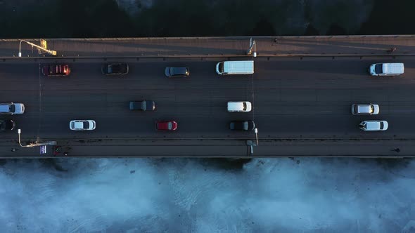 City Traffic on the Bridge at the Winter in the Evening