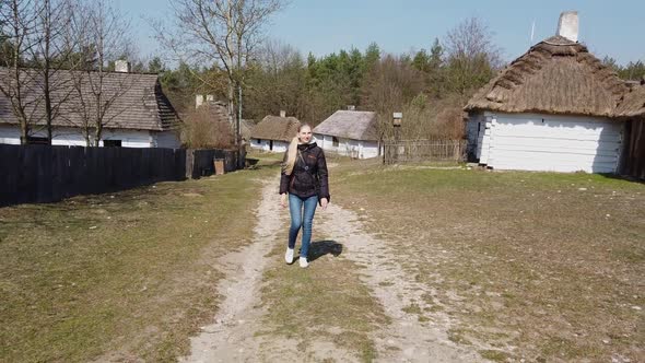 Woman Walking on Old Celtic European Village