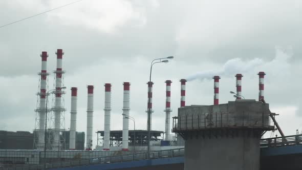 Industrial View From Train Window. Pipes of the Thermal Power Plant. Pollution of the Environment.