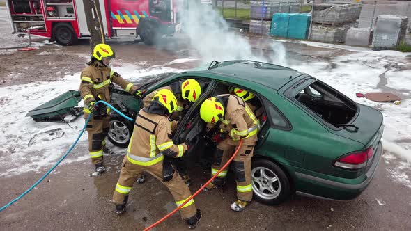 Firefighter Cutting Car Doors with Hydraulic Cutter. Car Accident