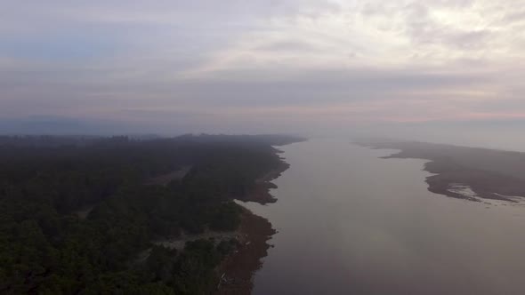 Drone footage flying over New River in Oregon. Running parallel to the Pacific Ocean for nine miles,