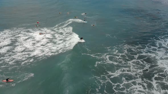 Aerial Shot of a Surfer Riding on a Wave