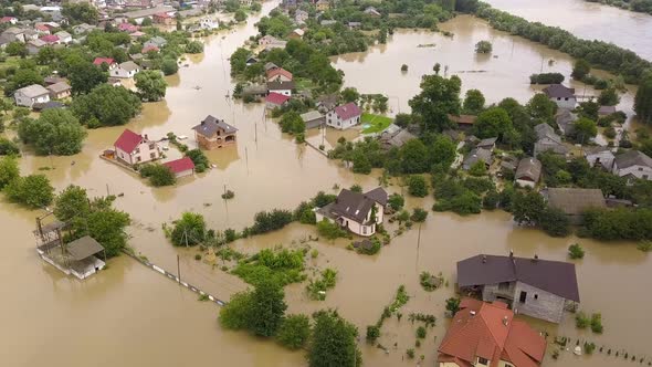 Aerial view of flooded houses with dirty water of Dnister river in Halych town, western Ukraine. alt
