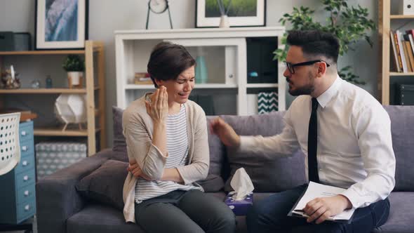 Caring Psychologist Helping Crying Woman Giving Paper Tissue Touching Shoulder