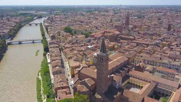 Panoramic aerial drone view of Verona, Italy. The drone moves away filming a video of the panorama
