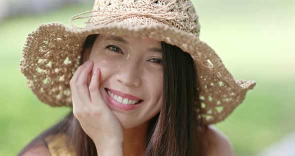 Woman smile to camera in the park