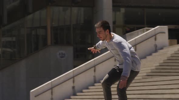 Caucasian man practicing parkour