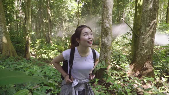 Asian Girl Hiking In Forest