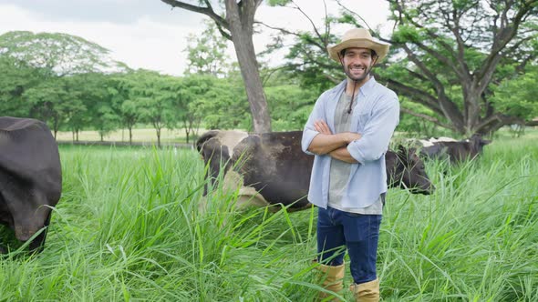 Portrait of Caucasian male dairy farmer working alone outdoors in farm.