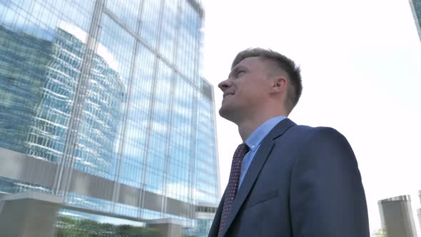 Positive Businessman Outside Office