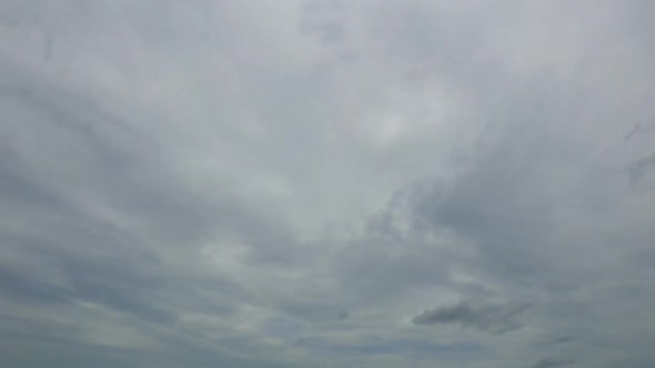 Time lapse of white cloud moving pass around sky background