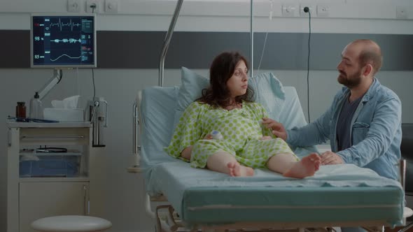 Happy Pregnant Woman Laying in Hospital Ward Bed