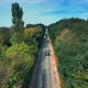 Aerial View Of White Car Driving On Country Road - VideoHive Item for Sale