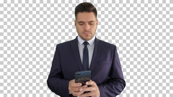 Serious businessman texting message on his phone, Alpha Channel