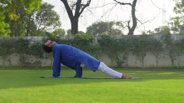 Advance yoga is being done by an Indian man