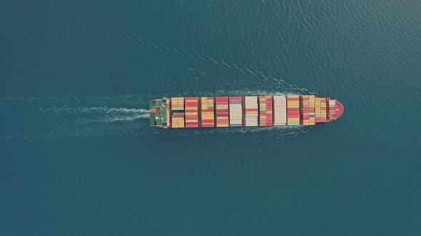 Aerial Top View Drone Flies Over to Large Cargo Ship