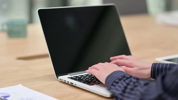 Woman Hands Typing on Laptop at Work