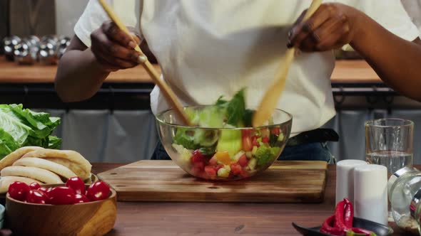 African American Chef Cooking Vegetable Salad